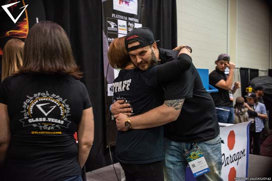 Orlando Glass Gallery Onstage Hugging GV Team