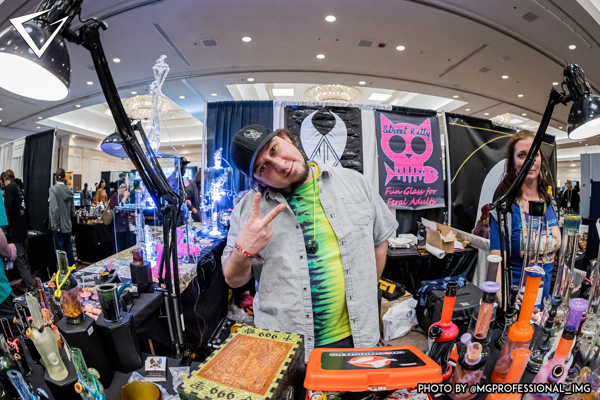 Artist at booth posing